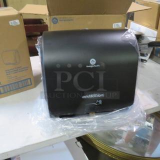 En Motion 59498A Hands-Free Paper Towel Dispenser, new in packaging, black, with Georgia-Pacific logo, on table.