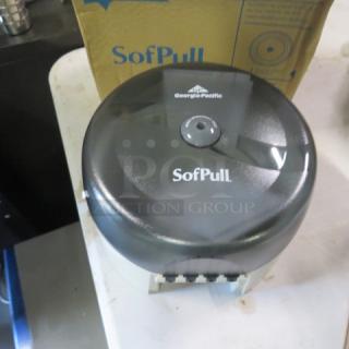 Georgia Pacific SofPull toilet paper dispenser, new condition, black, branded with logo, shown with packaging.