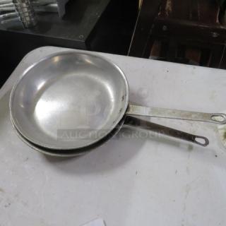 10.5 Inch sauté pan, stainless steel, lightly used condition, visible handle wear, ideal for versatile cooking tasks.