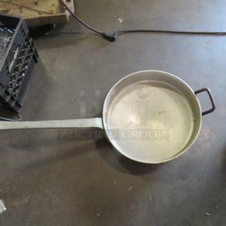 Long handle aluminum skillet, 16.5 inches; used condition, slight wear; ideal for professional kitchens.