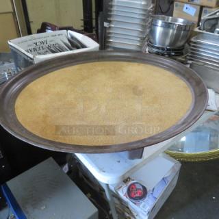 Oval serving tray, 27.5x23 inches, metal rim with textured surface. Good condition, suitable for catering use.