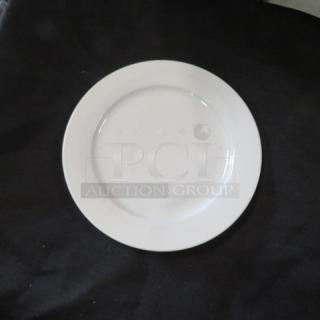 9-inch white Maxwell Williams plate, smooth surface, excellent condition, model 12XBID.