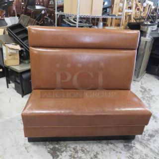 Single-sided brown cushioned booth, 48x25x45 inches, vinyl upholstery, used condition, ideal for restaurant seating.