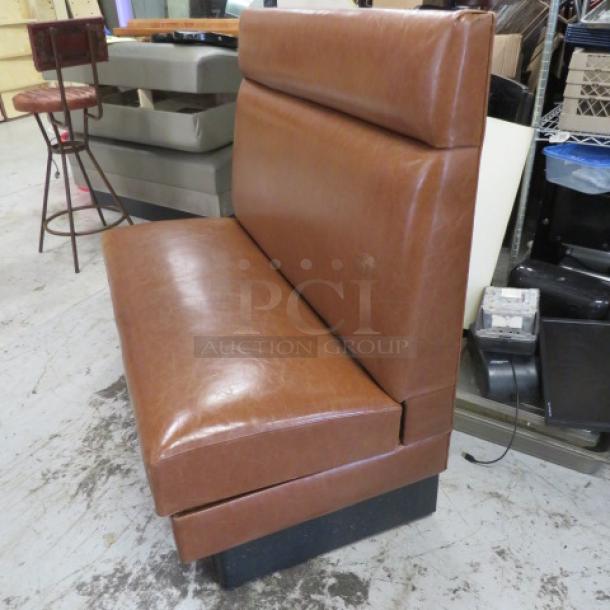 Single-sided brown cushioned booth, 48x25x45 inches, excellent condition, featuring a smooth leather-like finish.