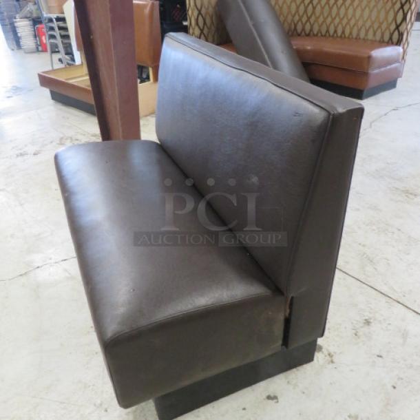 Single-sided chocolate brown cushioned booth, 48x26x36 inches, gently used, ideal for restaurant seating.