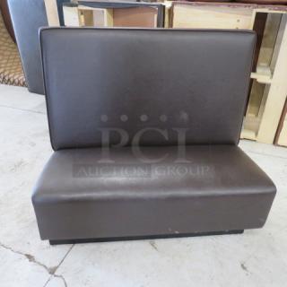 Single-sided chocolate brown cushioned booth, 48x27x45 inches. Good condition, ideal for restaurant seating.