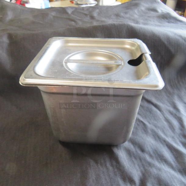 1/6 size 6-inch deep hotel pan with lid, stainless steel, scratch-free, with utensil notch on lid.