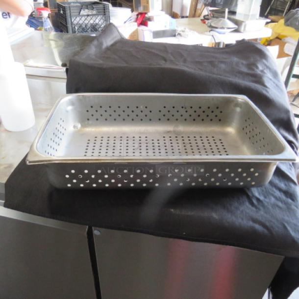 Full-size 4-inch deep perforated hotel pan in stainless steel, used condition, ideal for steaming and draining.