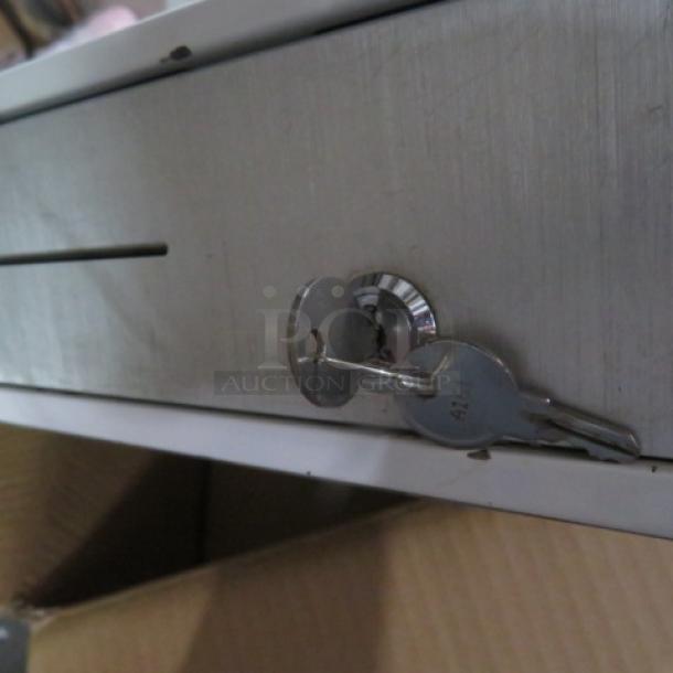 Clover cash drawer with lock and key attached, metal finish, good condition. Slot visible, key labeled "4121."