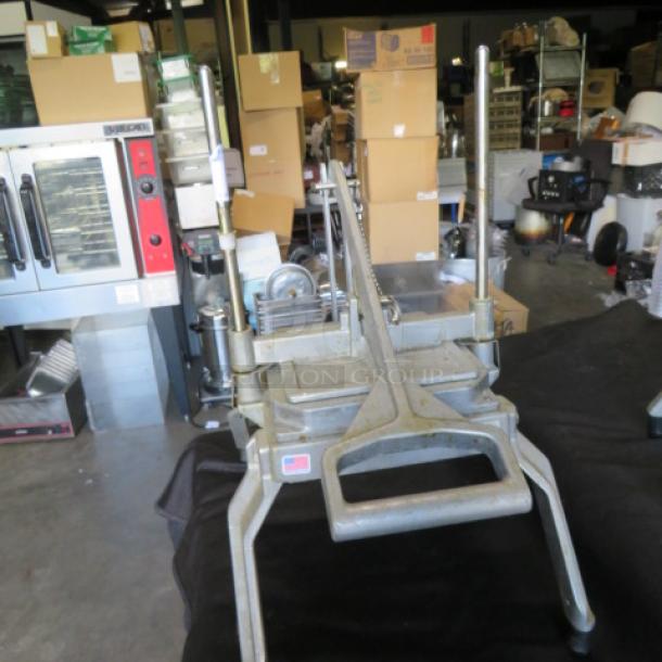 Nemco 55650 vegetable/lettuce cutter, metal frame, hand-operated, used condition. Ideal for efficient vegetable slicing.
