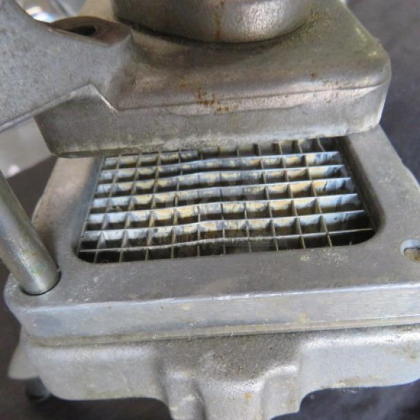 Nemco vegetable cutter with grid blades, metal construction, visible wear, suitable for commercial kitchen use.