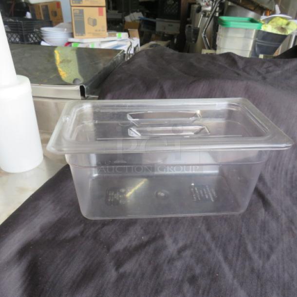 Clear 1/3 size, 6-inch deep food storage container with lid. Made of durable plastic, ideal for kitchen storage. Model: 2XBID.