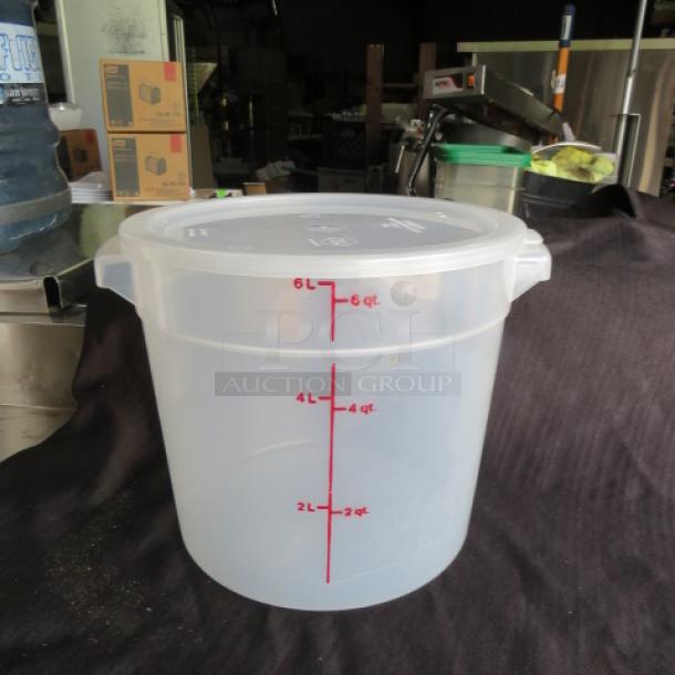 6-quart round food storage container with lid. Transparent with red measurement markings. Excellent condition.