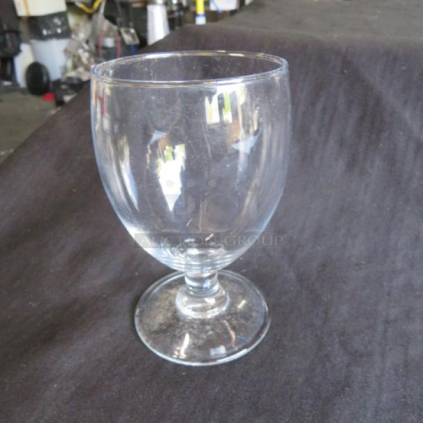 Clear stem water glass, model 12XBID, in good condition. Cylindrical bowl with smooth finish and stable round base.
