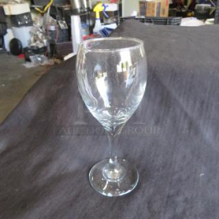 Clear stem wine glass, gently used, elegant design, ideal for wine enthusiasts. No visible labels or markings.