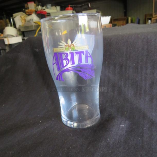NEW Abita Beer Glass, 11XBID, clear glass, colorful Abita logo, pristine condition, collectible barware item.