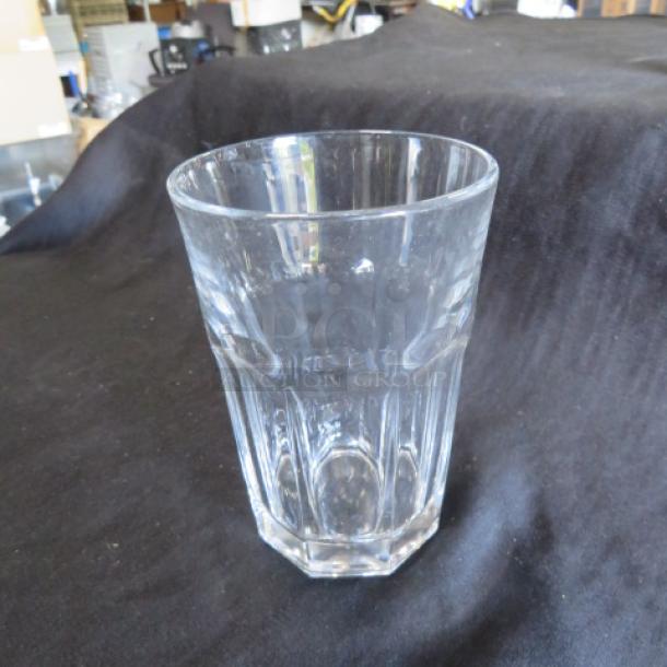 Clear glass bar/cocktail glass, 12-sided, octagonal base, excellent condition, ideal for beverages.