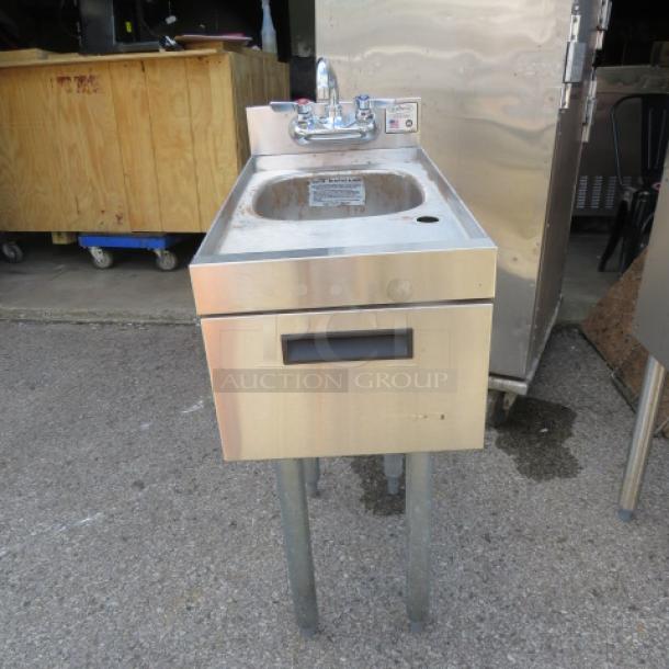 Stainless steel Krowne underbar hand sink, model 18-12DST, with faucet. Dimensions 12x24x34. Slight wear visible.