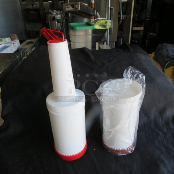 NEW Store And Pour set, two white containers with red spouts, one wrapped in plastic, ideal for kitchen storage, unused.