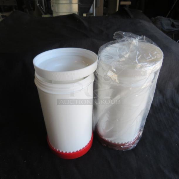 New Store and Pour containers, set of two, white with red bases, one sealed in plastic. Ideal for kitchen storage.