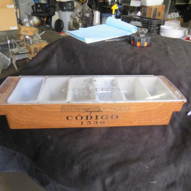 Código Tequila Dome Bar Center, wood finish, six compartments, Código 1530 branding, good condition.
