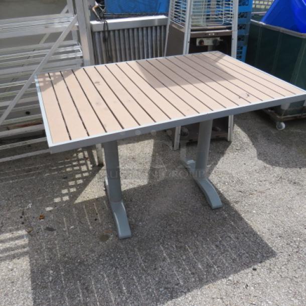 BFM synthetic teak and aluminum patio table, 48x32x30 inches. Sturdy, weather-resistant, ideal for outdoor use.