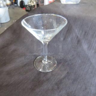 Clear martini/bar glass, classic conical shape, good condition, suitable for cocktails. No visible markings or branding.