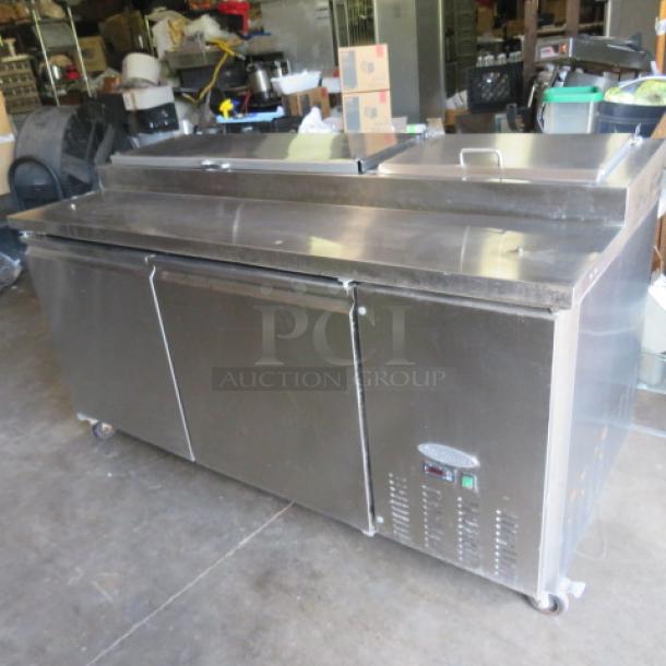 Servware 2 Door Refrigerated Prep Table, Model PP67-9, 71x32x40 inches, stainless steel, on casters, working condition.