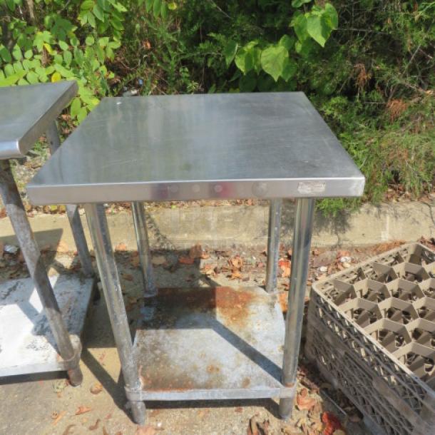 Stainless steel table with under shelf, 24x24x34 inches, showing some rust on legs and shelf.