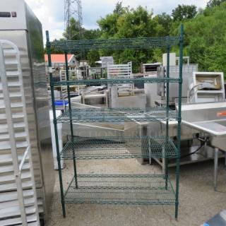 Green Metro shelving unit with 5 wire shelves, dimensions 48x24x75.5 inches, in good condition, suitable for storage.