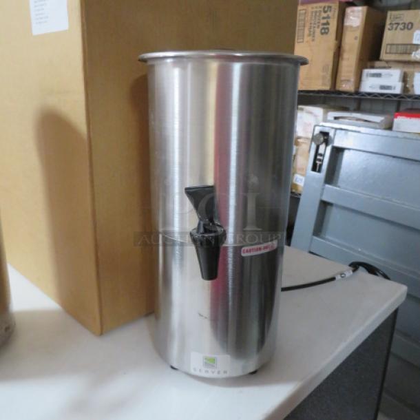 Server SY1.5 syrup warmer; 1.5-gallon capacity, stainless steel, 120V, 350W, tap dispenser, good condition.