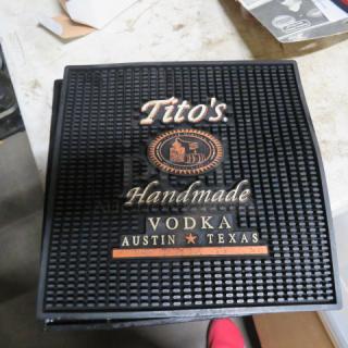 Tito's 11x11 black rubber bar mat, featuring "Tito's Handmade Vodka Austin Texas" branding in white and gold.