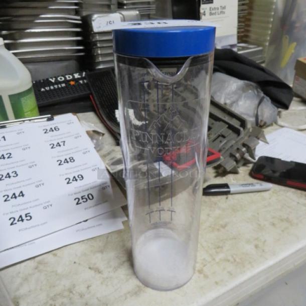 Pinnacle Vodka 750ml tower, new condition, clear with blue lid, Pinnacle Vodka branding visible.