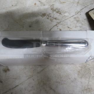 One dozen new solid handle butter knives, sealed in clear packaging, showing sleek metallic design and smooth blade.