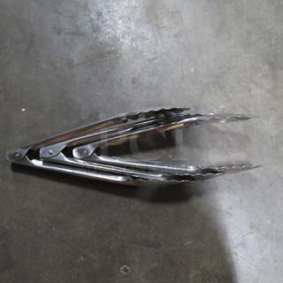 Stainless steel 9-inch tongs, excellent condition, features scalloped edges for grip, ideal for cooking or serving.