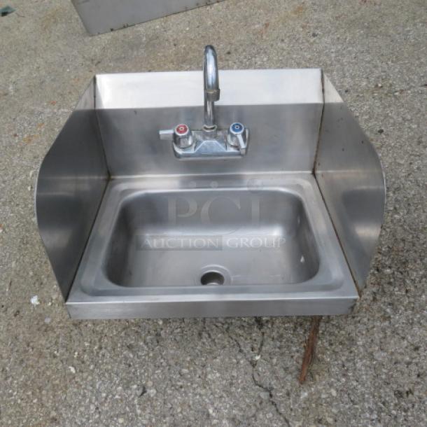 Stainless steel handsink, 17x15 inches, with faucet, side and back splash; used condition.