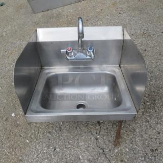 Stainless steel handsink, 17x15 inches, with faucet, side and back splash; used condition.