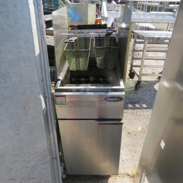 Cookrite ATFS-40 natural gas deep fryer with 2 baskets, R/L side splash. Stainless steel, 16x30x50 inches, excellent condition.