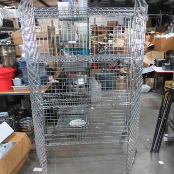 Metro 2 Door Liquor Cage, 48x18x70, wire construction, includes 2 racks, on casters for mobility.