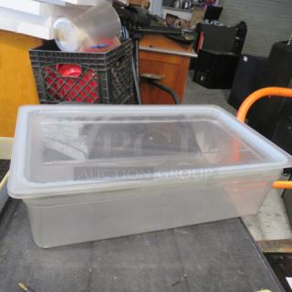Clear 6-inch deep full-size food storage container with lid, in good condition. Ideal for storing bulk items.