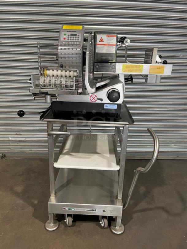 Bizerba VS12DV commercial deli slicer on metal stand with retractable casters, shown in good condition, 120V power.