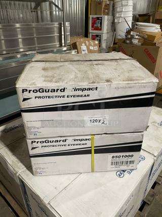 ProGuard Impact protective eyewear boxes, model 8501000, stacked in warehouse, holding 144 pieces each.