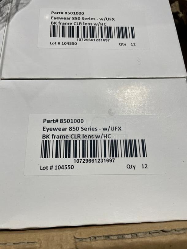 ProGuard Model 8501000 protective eyewear, black frame, clear lens, new, box label shows part number and quantity of 12 per box.