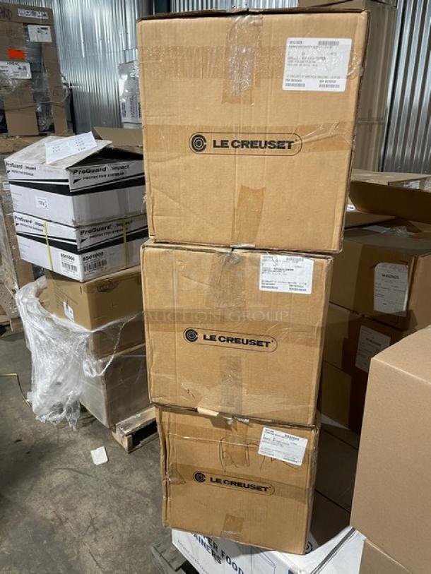 Brand new Le Creuset enameled cast iron 6-3/4 Qt. Signature Oval Dutch Oven in box, includes lid. Marked "Le Creuset."