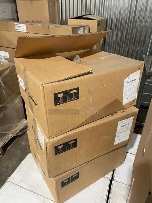 Stacked boxes containing new Le Creuset 6-3/4 Qt. Signature Oval Dutch Ovens, labeled fragile, with shipping labels.