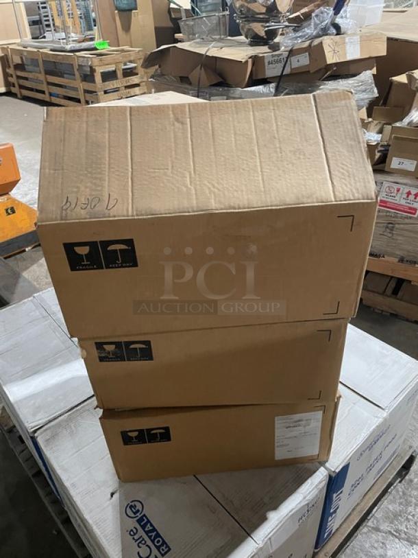 Three stacked Le Creuset boxes containing brand new 6-3/4 Qt. Signature Oval Dutch Ovens. Boxes labeled for handling.