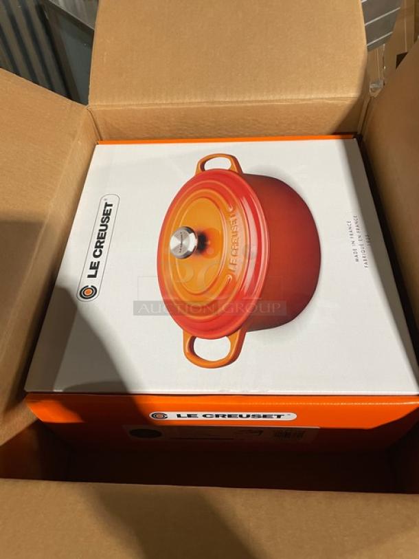 Brand new Le Creuset enameled cast iron 6-3/4 qt. Signature Oval Dutch Oven with lid in original packaging.