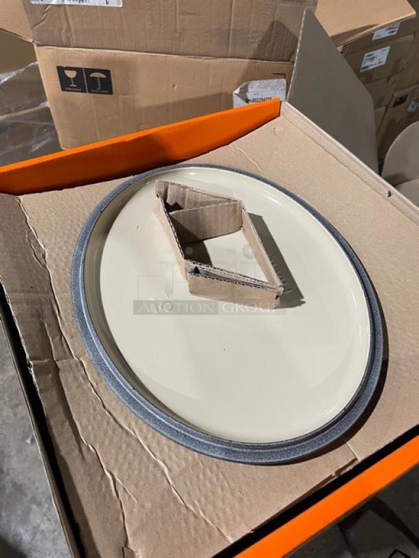 Brand new Le Creuset 6-3/4 Qt. Signature Oval Dutch Oven lid in box; enameled cast iron, pristine condition.