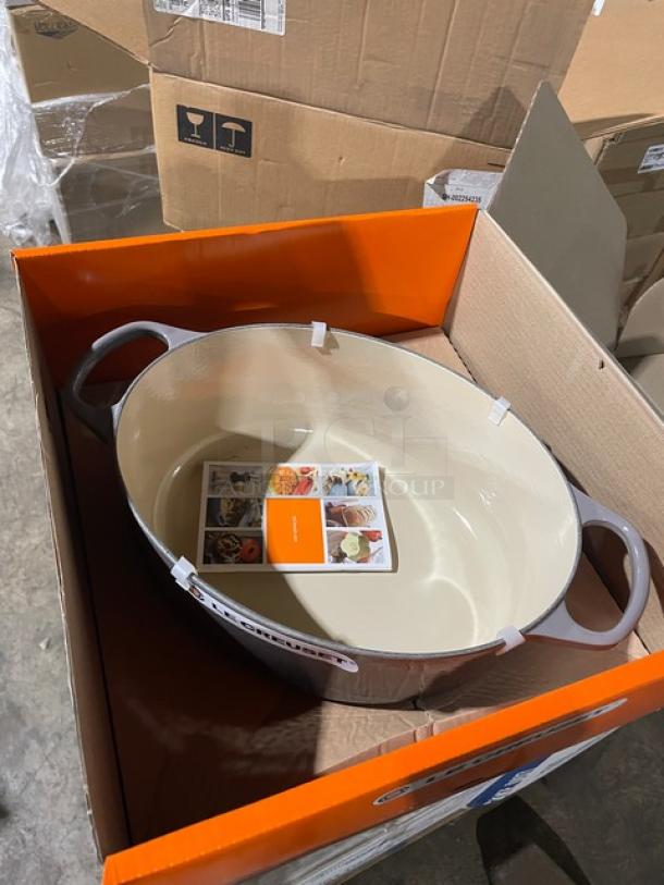 Brand new Le Creuset 6-3/4 Qt. Signature Oval Dutch Oven in box. Enameled cast iron, includes lid and brochure.
