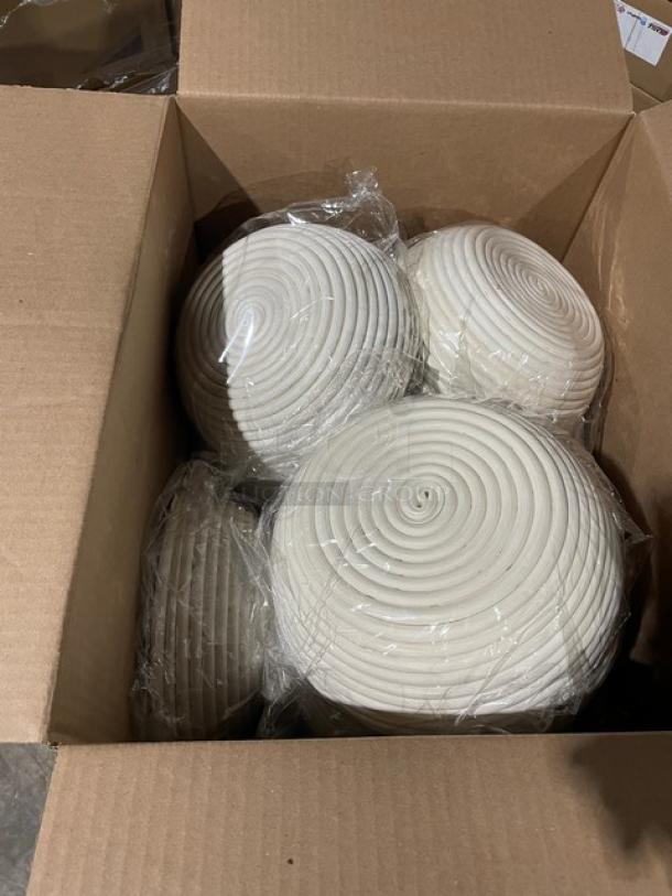 Brand new Vollum V3001LIN 8.5" round bread rising baskets in packaging, linen included, in an open box.